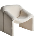 Sillón Bats tapizado en algodón bouclé con estructura de madera de pino, diseño elegante y confortable para cualquier espacio del hogar.