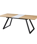 Mesa de comedor extensible con estructura metálica y tapa en DM bilaminado, ideal para espacios modernos.